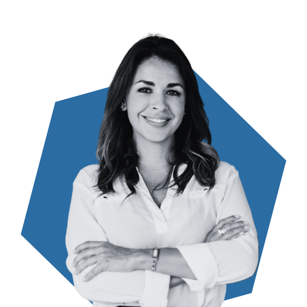 Confident salon professional smiling with arms crossed, representing success powered by Sunlync software